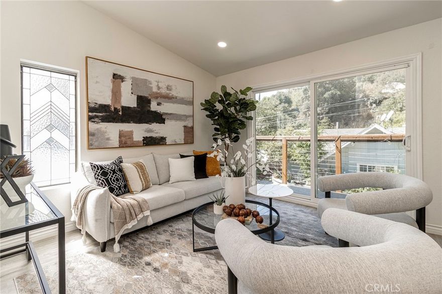 Tucked into the canyons of Sierra Madre, this updated home offers the perfect balance of retreat and convenience. Built in 1984 and refreshed in recent years—with a newer roof, remodeled kitchen and primary bath, updated patio doors, and fresh paint inside and out. The two-story layout is both comfortable and practical. The lower level includes two bedrooms, a full bath, and a laundry area. Upstairs, vaulted ceilings open up the main living space, where the kitchen, dining, and living room flow together easily. A fireplace anchors the room, and sliding doors lead out to a balcony where you can enjoy fresh air or look up at the stars. The primary suite feels generous, with a walk-in closet and a full ensuite bath.

Life here is as much about the setting as the home itself. The canyon is quiet and walkable, with footbridges and the sound of a nearby creek adding to the charm. Local favorites like Mary’s Market, Sierra Madre Playhouse, Baldwin Gallery, and Nano Café are just minutes away, while nearby hiking trails make it easy to enjoy the outdoors. And when you need to get back to the city, the 210 Freeway is just a couple of miles away. Families will also appreciate the highly rated Sierra Madre Elementary and Middle School.