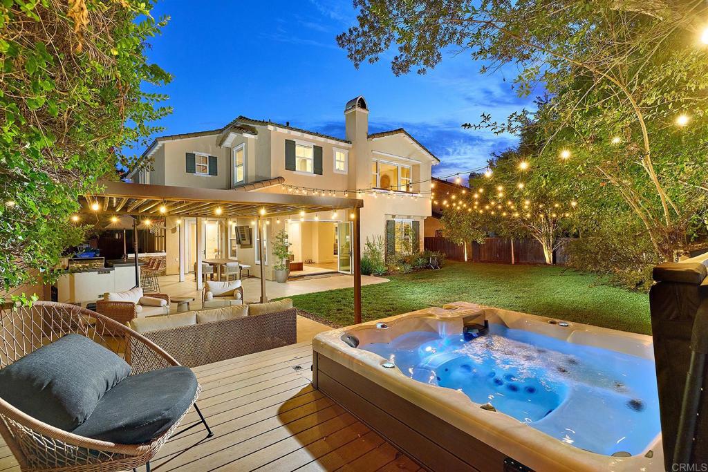 Nestled in the heart of Bressi Ranch, this reimagined and beautifully remodeled 5-bedroom, 3 full bath plus 2 half bath residence offers the perfect blend of style, comfort, and community. Just a short stroll from the vibrant community pool, clubhouse, charming parks, and neighborhood shopping & dining at Bressi Village, with quick access to Trader Joe’s, Sprouts, Bird Rock Coffee and so much more. Step inside and you’re welcomed by a grand entrance with soaring ceilings, new LVP flooring, and designer-selected finishes that bring warmth and elegance to every corner. The open, flowing floor plan is designed for the way families live today, offering comfortable spaces to work, relax, and entertain. A versatile downstairs bedroom is ideal as a home office, playroom, or guest suite, while the formal living room provides a welcoming setting to greet family and friends. Host holiday dinners, birthday celebrations, or casual weeknight meals in the spacious dining room that flows effortlessly into the open great room. At the heart of the home, a stunning chef’s kitchen features an oversized island, on-trend quartz countertops with full backsplash, newer appliances and plenty of room for gathering around while meals are prepared. The adjoining family room is framed by expansive La Cantina doors, creating a true indoor-outdoor connection. Step outside to your private backyard oasis complete with a covered patio for weekend barbecues, cozy lounge area, a glowing fire pit, and a sparkling spa; perfect for making memories with loved ones all year round. At the top of the stairs, dual built-in workstations provide the perfect place for kids to tackle homework. Two oversized front bedrooms share a convenient Jack & Jill bath, while the spacious middle bedroom enjoys its own ensuite; offering comfort and privacy for family or guests. The expansive primary retreat serves as a true sanctuary, designed for rest and relaxation at the end of each day. With a spacious 3 car garage with a 220v outlet for EV charging, there’s plenty of room for all your weekend toys, hobbies, and storage needs. From bikes, surfboards to holiday decorations or a golf cart, you’ll have the space to keep everything organized while still enjoying the convenience of ample parking. Designed with today’s lifestyle in mind, this home is as smart as it is beautiful. Fully owned solar panels and newer dual-zone air conditioning provide year round comfort while keeping energy costs low. Just minutes away are the award winning Carlsbad schools, Pacific Ridge School and world-class destinations including La Costa Resort, Park Hyatt Aviara Resort and the pristine Carlsbad beaches.