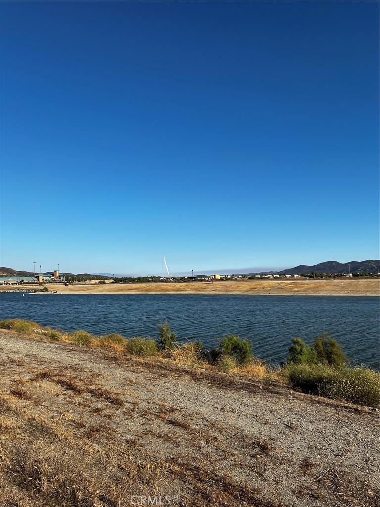 "The city is growing, and we offer you're the great opportunity to build your house with a Lake view. Property is walking distance to private beach area of the lake. Area features include biking, boating, hiking and other outdoor activities. Lake Elsinore located in a residential neighborhood, Property is close to all services including schools, shopping, frwy access and Outlets at Lake Elsinore. The Land is flat and easily accessible.