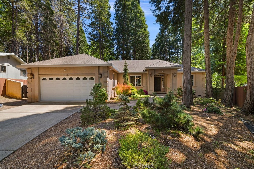 This beautiful 2007 built home has so much to offer including 18 owned solar panels with a battery backup! You will also appreciate a newer HVAC system, new water heater, and recirculating pump. As you pull up to this property, you will find low maintenance woodland native landscaping. Step through the front doors and you will be greeted by a lovely tiled foyer that leads to the formal dining area with wood floors that open to the cozy living room with a gas fireplace as a centerpiece to the space. This home boasts a split floor-plan where one wing of the house offers two guest bedrooms that are jack and jill to the adjoining guest bathroom. The guest bath features dual sinks with granite countertops and tile backsplash. The vanity area is separate from the shower and water closet offering extra privacy between the two adjoining bedrooms. The kitchen is a delight as it also boasts matching features with granite countertops, a beautiful stainless steel Maytag refrigerator, matching stainless dishwasher, a new stainless microwave, granite composite sink, and beautiful custom tile work backsplash throughout. Off the kitchen is a dining nook that looks out to the lovely backyard deck. The main wing of the house where the primary suite awaits features an extra 1/2 bath near the kitchen area for extra company. The half bath also boasts beautiful surrounding tile work. You will love the spacious primary suite which boasts a stunning bathroom with walk in shower, 2 vanity areas with a soaking bathtub sandwiched between them. The primary bathroom boasts matching granite and tile throughout. The laundry room is also conveniently located inside its own separate room on the way to the oversized 2 car garage where you will find extra built in storage. This home is situated on a .31 acre lot that offers a beautifully maintained raised deck, pavers, raised garden beds, and lamp posts for added backyard charm. The backyard surrounding fence is also newer and stained to match beautifully. This home is totally move in ready, modern, and ready for its next owners! Do not let it pass you by!