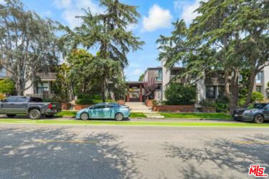 Location, location, location. Minutes to Montana Avenue shopping, restuarants, markets and the Beach. This 2 story townhouse in prime Santa Monica location is light and bright with an open floor plan. This attractive end unit has only one common wall. Formal entry with powder room and guest closet open onto a large Living space and dining area that overlooks the Kitchen with plenty of cabinetry and granite counter tops and new flooring. Main living space has hardwood flooring, fireplace and sliding doors that open onto a private large patio area great for enteraining. Upstairs are 2 bedroom + 2 baths and a closet. Primary Bedroom has vaulted ceilings, lots of closet space and another balcony. The Primary bathroom has been totally remodeled, separate tub and shower. Central A/C & Heat. Good size 2nd bedroom with closets. Side by side parking in gated garage along with private laundry area (located in garage).