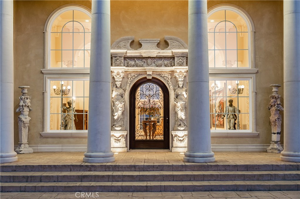 Grandeur, Refinement and Sophistication awaits at this Magnificent and One-of-a-kind Estate, tucked behind the guard-gated Impressive Gates of Prestigious Meadow Oaks. No Expense was spared in the Design of this Luxurious Roman-inspired Single Story Residence, Exemplifying the Finest Blend of Art, History, Architecture and Modern Amenities. Alluring Entry Includes Private Gate with Stunning Bronze Statue, Circular Driveway, Breathtaking Cathedral Ceilings, Numerous Antique Imported Swarovski Crystal Chandeliers, Hand Carved Mantels/Fireplaces, Two Story High Awe-Inspiring Arched French Windows offering Expansive Views of Rolling Hills and Meadows. Calling all Gatsby Aesthetes alike! Almost 11,000 Sq Ft, Five Generously sized En Suite Bedrooms, Eight Bathrooms. Resort Style Backyard. Elegant Swimming Pool lined with Beautiful Four Seasons Statues, Massive Loggia with 15 Person Spa. Life size Bronze Statue of Archangel Michael is Included as well! You and your Guests will Love your Private Pond stocked with Fish (Bass, Bluegill and Tilapia). Plan and make your future memories with your loved ones and your friends at this magical property on sprawling almost five acres of land of this Roman Palazzo. Live your best Gatsby party every day in Unparalleled Luxury, break away from the ordinary! Large Bar and Lounge, Home Theatre with 4K Projection and Premier Sound are Included, as well as an Exquisite Library. Enjoy hosting parties, or quiet moments of meditation in these truly tranquil surroundings. Retreat and Rejuvenate in your 1,500 Sq Ft Master Suite that Includes an Antique Claw Foot Soaking Tub made of Hand Carved Stone and So Much More! An Oversized Garage currently holds seven vehicles, so Car Collectors bring your Gems! True 1 of 1 !