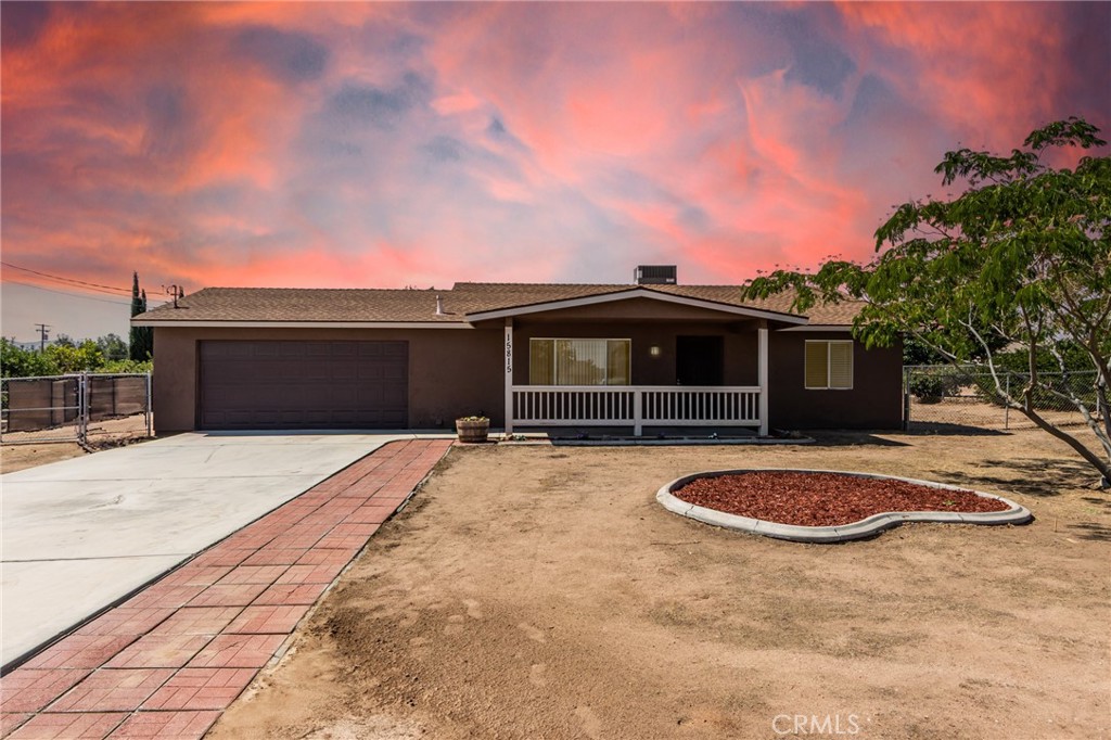 Charming single-story home in The Mesa! This comfortable 2-bed / 1-bath residence (~972 sq ft) sits on a generous fenced .41-acre lot—perfect for horse lovers or those seeking space and privacy. The home features laminate flooring throughout, central heating & A/C, and a 2-car garage with RV access** Located in a commuter-friendly area near shopping, schools, and the Gateway Center. Exceptional value in Hesperia’s sought-after Mesa neighborhood!