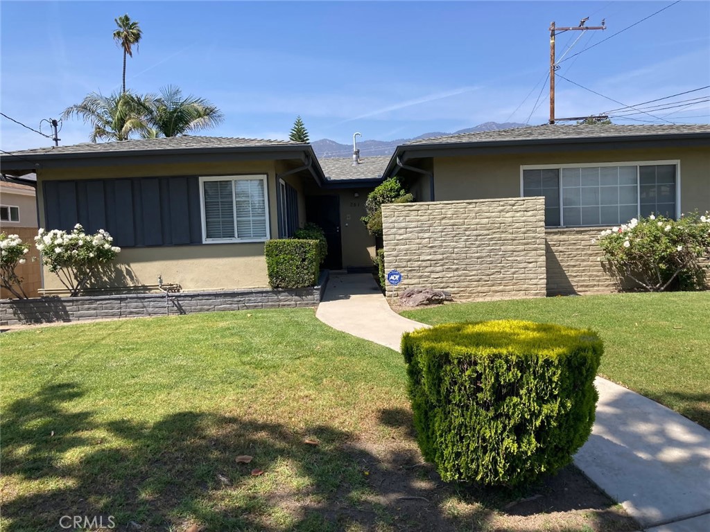 Good news!...Seller has agreed to offer $10,000 for closing costs OR 2/1 rate buy-down! Welcome to 261 East. Fig Ave, a beautifully maintained and move-in ready home in the heart of Monrovia. This charming property features 3 bedrooms, 1 ¾ bathrooms, and a versatile flex room perfect for a home office or gym. With rich laminate wood flooring throughout, and laminate tile flooring in the kitchen and bathrooms, Updated in (2016). A stunning wood burning rock fireplace in the living room, and an updated roof in (2016), this home blends comfort and style seamlessly. Attached two-car garage, with easy access to the kitchen, which includes a remote garage door opener for added convenience. The washer and dryer located in the garage are also included in the sale, Updated central A/C and heating unit in (2016), also two A/C wall units. Updated windows throughout, except for the flex room. All ceiling fans included. The beautifully landscaped front and back yards provide a peaceful and private outdoor setting, with a remote-controlled rear gate adding extra parking and privacy. Brick wall encloses the back yard. Ideally located near the 210 Freeway, Metrolink on Myrtle Ave, and Duarte Square on Duarte Rd. and restaurants and shops, also enjoy the Street Fair every Friday in Old Town Monrovia. This home offers the perfect combination of location, convenience, and lifestyle.