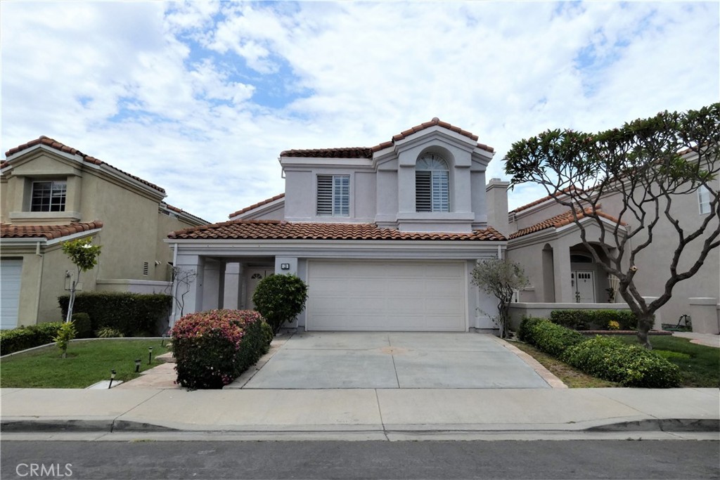Welcome to this beautiful single family house located in Westpark. This is the largest floor plan in Tierra neighborhood. Big Backyard with a courtyard entry. Quiet inside tract. Light, bright and open floor plan with soaring high ceilings letting in lots of natural light. Wood plantation shutters and brand new laminate flooring throughout. Spacious living room with formal dinner area. Separate family room accompanied with a cozy fireplace. Remodeled gourmet kitchen featuring recessed lights, maple cabinetry, granite countertops and stainless steel appliances. Double vanity and renovated shower/tub in both master and secondary bathrooms. Walk-in close in master and mirrored closet doors in all other bedrooms. Enjoy the numerous Westpark amenities including swimming pools, tennis courts, basketball court, lots of parks, playgrounds and much more. Walking distance to Westpark Elementary. Minutes away from Irvine Spectrum. Close to freeway entrance and shopping center. Short drive to UCI, John Wayne airport, South Coast Plaza, beach, etc.