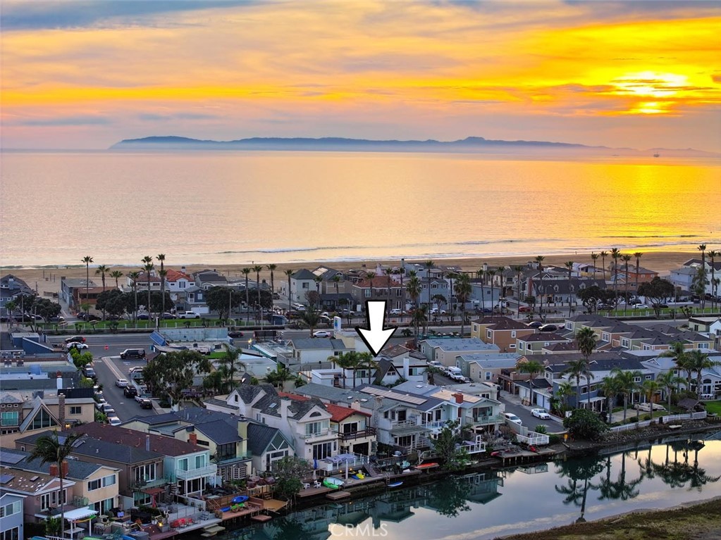Welcome to 210 Grant St, Unit A, a beautifully remodeled lower unit in a high-end Newport Beach duplex, ideally located between the Canal and the Pacific Ocean. This upgraded 3-bedroom, 2-bath home features an open floorplan with a modern kitchen, quartz countertops, high-end stainless-steel appliances, and a spacious island with bar seating. Enjoy luxury touches throughout including smart mirrors, dual sinks, a smart toilet, vinyl flooring, ceiling fans, dual-pane windows, interior laundry, and a 1-car garage with alley access. Outdoor living is enhanced with a sunny front patio and close proximity to the beach, canal, and popular local spots like Frog House Surf Shop, restaurants, and cafes. Located just steps from one of Newport's best beaches and within the Newport-Mesa School District, this home offers the best of coastal living. Photos are from 2024, taken prior to the previous tenant's occupancy. This is a 12-month unfurnished lease. Available today.