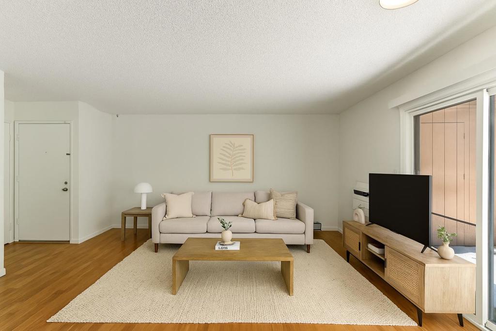 This charming 2 bedroom, 1 bathroom condo offers 789 sq. ft. of comfortable living in a peaceful and well-maintained neighborhood and just 5 minutes by car or 20 minutes on foot to Fremont BART Station and Central Park. The home features upgraded wood floors and a spacious living area that flows seamlessly throughout. Both bedrooms offer closets for ample storage, while an in-unit washer and dryer add everyday convenience. The bathroom includes a bathtub, providing a relaxing retreat. A large private patio with extra storage creates the perfect space to unwind or entertain outdoors. Additional highlights include an assigned carport with free guest parking and access to the community heated pool. This move-in ready condo is a fantastic opportunity to own a home with excellent amenities in one of Fremonts most convenient locations.