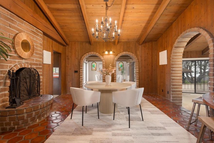 Experience the epitome of timeless elegance with this stunning Adobe residence crafted by Weir Brothers in 1979, offering breathtaking ocean views. Situated on a spacious 0.28-acre corner lot just four blocks from the pristine beaches of Del Mar, this exquisite 3-bedroom, 3-bathroom home encompasses 3,437 square feet of refined design and masterful craftsmanship. A gated entry leads to a welcoming courtyard, opening seamlessly to arched doorways that invite you inside. The interior is illuminated by graceful Gothic-style chandeliers and light fixtures, highlighting the open-concept family room and spectacular ocean views. The spacious living areas include a formal dining room, a cozy breakfast nook, a generous family room, and an elegant loft/library—each capturing the serene coastal landscape. The primary suite boasts dual vanities, separate closets, and ocean views, creating a private retreat. Outdoors, enjoy wrap-around decks nestled among mature pines and overlooking the sparkling ocean. The meticulously landscaped yard features a pool and Jacuzzi, perfect for summer entertaining, as well as a tranquil side yard with mature plantings and a peaceful sitting area. Additional amenities include a brand-new refrigerator and washer and dryer. This distinguished family home seamlessly combines enduring architectural beauty with modern comforts, embodying the iconic beachside lifestyle of Del Mar.