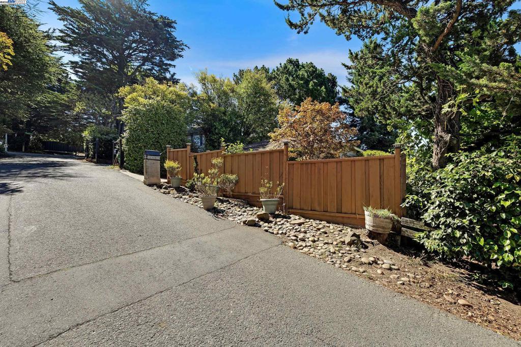Beautiful Piedmont Pines home features mid-century charm and pride of ownership. First time on market after almost 70 years. Everything works and is ready for your modern touches. This cozy 2 bedroom home could easily have a third bedroom in place of the downstairs den. Hardwood floors, views of downtown SF from the kitchen and bedroom, off street parking plus a garage. The close-knit neighbors gather frequently at the mailboxes, or for a hike into neighboring Reinhardt Regional Redwood Park. This one won't last. Section 1 Pest Report clearance. Views: Downtown