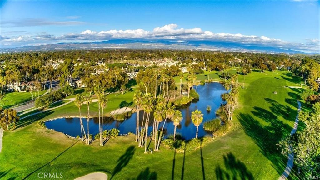 PANORAMIC GOLF COURSE VIEWS! 20 Nuevo sits in perhaps the finest location on Rancho San Joaquin Golf Course. Just steps from your private
garage is this light filled corner unit with views that perfectly frame the 12th green and lake beyond. Featuring 3 bedrooms, 3 balconies, and an open floor plan that takes full advantage of the views. Tumbled marble graces most of the floor with real hardwood in the bedrooms. Granite counters and stainless steel appliances create an inviting kitchen. A private master suite with its own balcony and stunning golf course views complete this rare opportunity. Enjoy resort-like living in either of the 2 exclusive community pools and spas nearby. Additionally, the community is conveniently located near top-rated schools, shopping, and recreational amenities, including the 95 acre William Mason Park, just across the street.