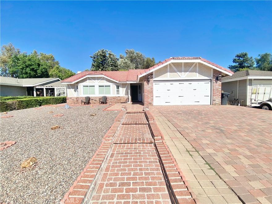 Welcome to this beautifully updated 3-bedroom, 2-bath home in the heart of Lake Elsinore, offering comfort, style, and low-maintenance living both inside and out. This home features a versatile bonus room in the converted garage — perfect for a home office, gym, or guest space.

Step inside to fresh interior and exterior paint, along with new tile flooring in the bedrooms and upgraded tile in the master suite. The master bedroom also includes a patio slider for direct access to the backyard.

Enjoy outdoor living with a covered patio and large cement slab, ideal for entertaining. The backyard is thoughtfully designed with decorative pavers, rock landscaping, and fruit trees lining the back wall, creating a relaxing, low-maintenance retreat. The front yard features custom rock and brickwork, enhancing curb appeal while remaining drought-friendly.

Don’t miss this move-in-ready home that blends functionality, upgrades, and outdoor charm — all in a great location!