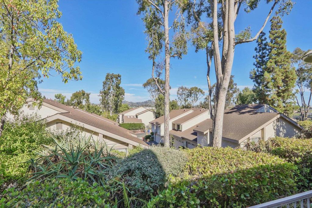 Amazing Townhome that is move in ready! Great location with beautiful mountain views and peaceful surroundings! Owned by same couple for over 29 years and shows pride of ownership! Well maintained townhome in immaculate condition. This is move-in ready with designer touches including oversized master bedroom with separate vanity and sink, luxury laminate flooring, granite counters in kitchen, upgraded carpet, upgraded baseboard, newer stainless steel refrigerator and dishwasher, newer water heater, storage loft in garage with stairs. Could be sold completely furnished and includes all appliances. The town home shows extremely well. Two car attached garage, community pools, newer clubhouse and newer exercise equipment. HOA is very solid and this is one of La Mesa's most desirable townhome complexes.