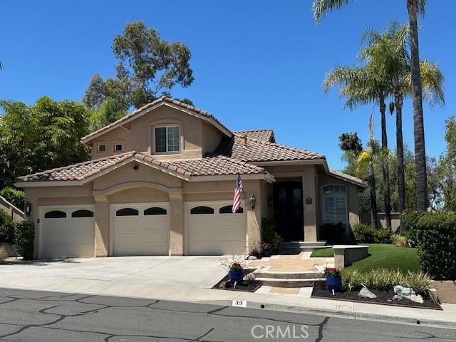 Your dream home awaits you at 39 La Purisima in RSM. This lovely home is filled with quality & luxurious amenities with a private rear yard with Spa, BBQ, Covered Detached Patio & sitting areas & breathtaking sunset views. Inside you’ll find cathedral ceilings and many custom built-in features. The entrance has a double Iron/Bronze entry door with operable screen windows. The home features 4 Bedrooms and 3 Bathrooms with the downstairs room configured as a home office w custom built in desk. The Kitchen & Family Room w fireplace were expanded to accommodate a large central island with granite top & breakfast bar seating. Kitchen amenities include custom cabinetry w self-closing doors/drawers, Stainless steel appliances & an amazing combination of Microwave & “Speed Cooker” & oven, pull out shelving in the kitchen and bathroom cabinetry. Inside separate laundry room w sink. Upstairs there are 3 Bedrooms & 2 baths including the master bedroom suite w walk in closet.
Additional Features – Double-pane windows throughout, all bathrooms have been upgraded & modernized custom shutters in the Living Room, custom 5” Baseboards throughout, travertine & ceramic tile flooring, 3” custom door & window framing. New insulated garage doors, garage has epoxy flooring, custom cabinets and motion sensor lighting & Tankless H/W system. The home also features an Indoor/Outdoor whole house stereo system.
Located just a short walk to award-winning Melinda Heights Elementary, Solana Park, and close to Trabuco Hills High School, shopping, restaurants. The HOA (SAMLARC) offers numerous amenities for the family to enjoy such as pools & spas, beach with clubhouse, lagoon, parks, basketball, tennis & pickleball courts, clubhouses for children parties, RSM Lake, pickleball and volleyball courts, tennis courts and trails and many more. You don't want to miss out on this fabulous home! No Mello Roos, Low Tax Rate 1.01%