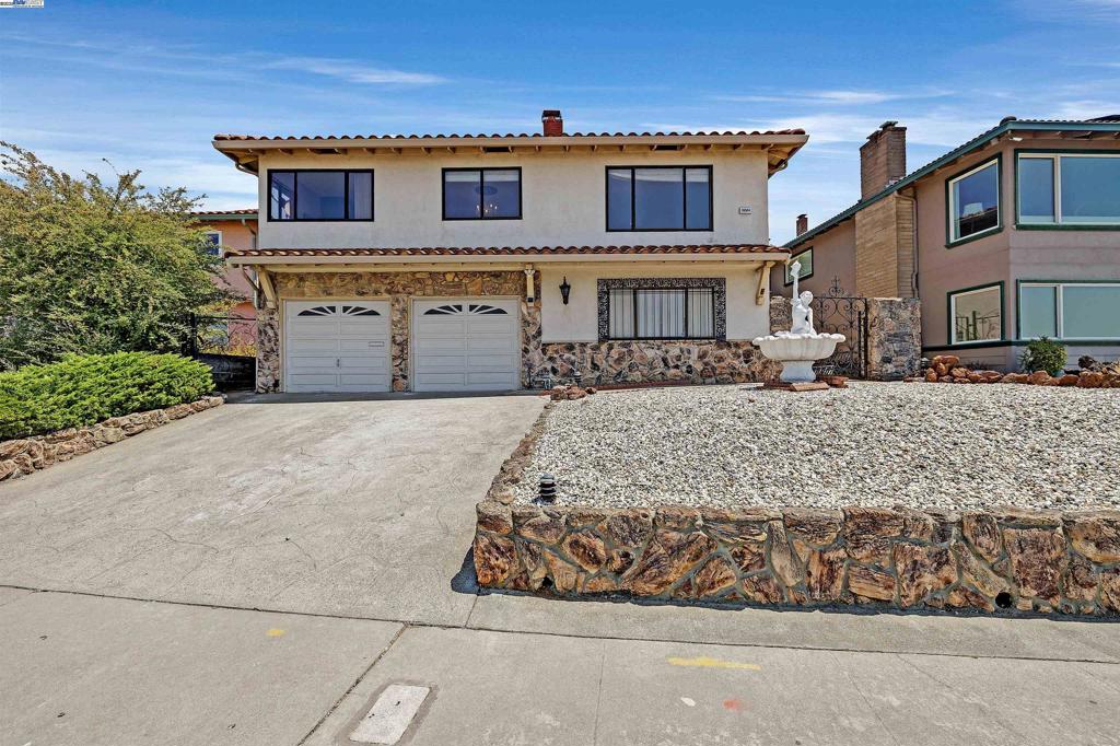 San Leandro Hills Home with Spectacular Bay Views! Don't miss this incredible opportunity to own a home in the highly desirable San Leandro Hills, offering breathtaking panoramic views of the San Francisco Bay right from your oversized living room and kitchen windows. This spacious residence is full of potential—ready for your personal touches to transform it into your forever home. The layout includes a large bonus room on the lower level, perfect for entertaining, with direct access to a generous garage space. Enjoy the low-maintenance front and backyard, giving you more time to relax and take in the phenomenal scenery. Conveniently located near the 580 freeway and local shopping, this home combines serenity with accessibility. Envision the possibilities in this hillside gem!