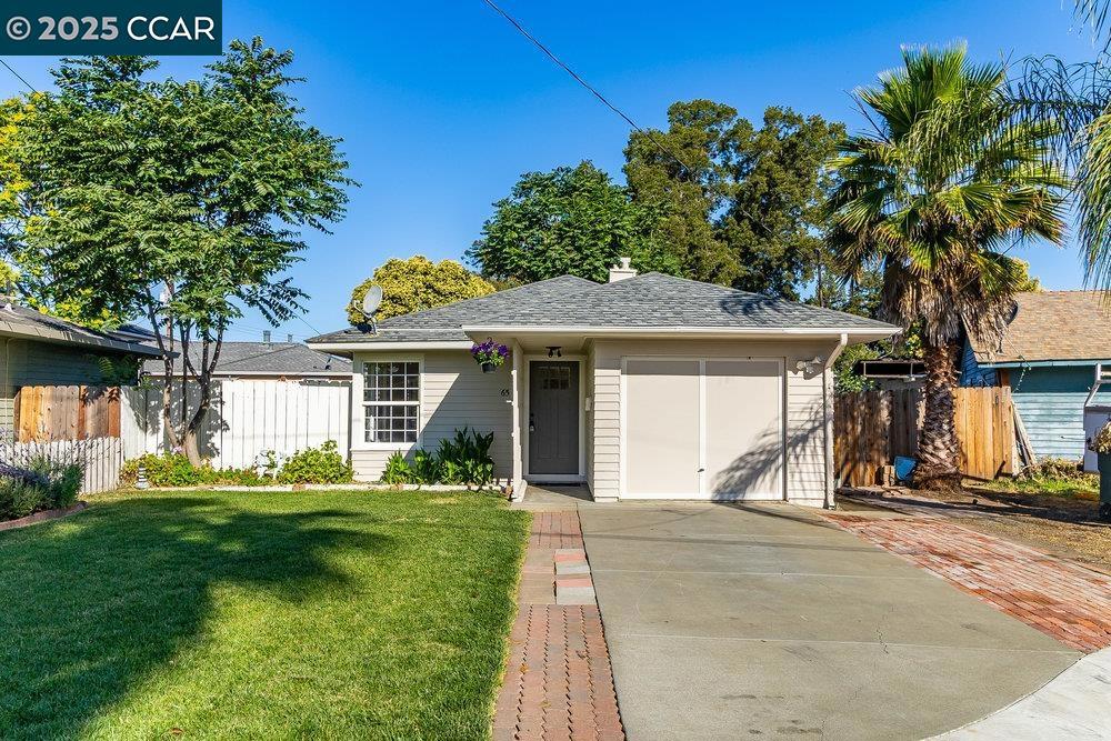 Charming home near downtown Pittsburg. Located in a court location, this darling 2-bedroom, 1 bath home has recently been modernized. The kitchen has been updated with all new cream-colored cabinets, champagne gold hardware, Quartz counters, new stainless-steel sink, faucet & lighting. The living room, dining area, kitchen and hallway have newly installed luxury vinyl. Both bedrooms feature new brushed nickel fans, and new carpet and padding. The bathroom features a new vanity, mirror, and light fixture. The entire interior was recently painted with new baseboards throughout. The exterior was also recently painted throughout, and a new front door was installed. The front landscaping has been loving maintained and has great curb appeal. If you love to garden, the backyard is a clean slate to make it your own oasis. Must see to appreciate the charm.