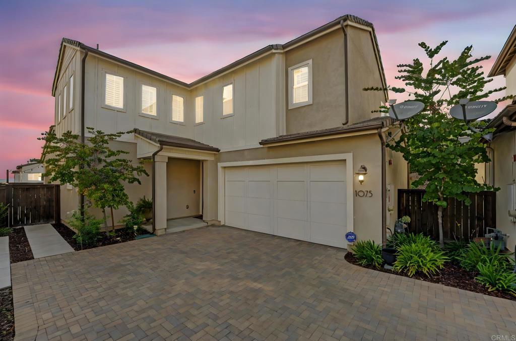 Assumable VA loan w/ 2.5% interest rate with the right offer! Dont miss out! Welcome to The Village of Escaya, where this bright and move-in-ready 4 bedroom + loft, 3 bathroom home is waiting for you! A full bedroom and bathroom on the first floor provide flexibility for guests. Inside you’re greeted by an open-concept that connects the kitchen, dining area, living room, and backyard space—perfect for entertaining family and friends. The chefs kitchen features generous countertop space, abundant cabinetry, walk-in pantry, stainless steel appliances, and an island with barstool seating. Upstairs, you’ll find the large primary suite with an en-suite bathroom and walk-in closet, along with two additional bedrooms equipped with ceiling fans, a shared bathroom, and a versatile loft ideal for a home office or play area. The convenience of an upstairs laundry room adds to the thoughtful layout. Outside is the large backyard retreat, complete with a covered patio for outdoor dining and a beautifully maintained hillside. Additional highlights include a brand-new A/C unit, paid solar, shutters throughout, tankless water heater, two-car garage, and second-level views. Living in Escaya means enjoying incredible community amenities, including monthly social events, parks, sport courts, sparkling pool and spa, an elementary school, local shops, and eateries. Plus, you’re just a short drive from Otay Ranch Town Center, major retailers, and dining options.
