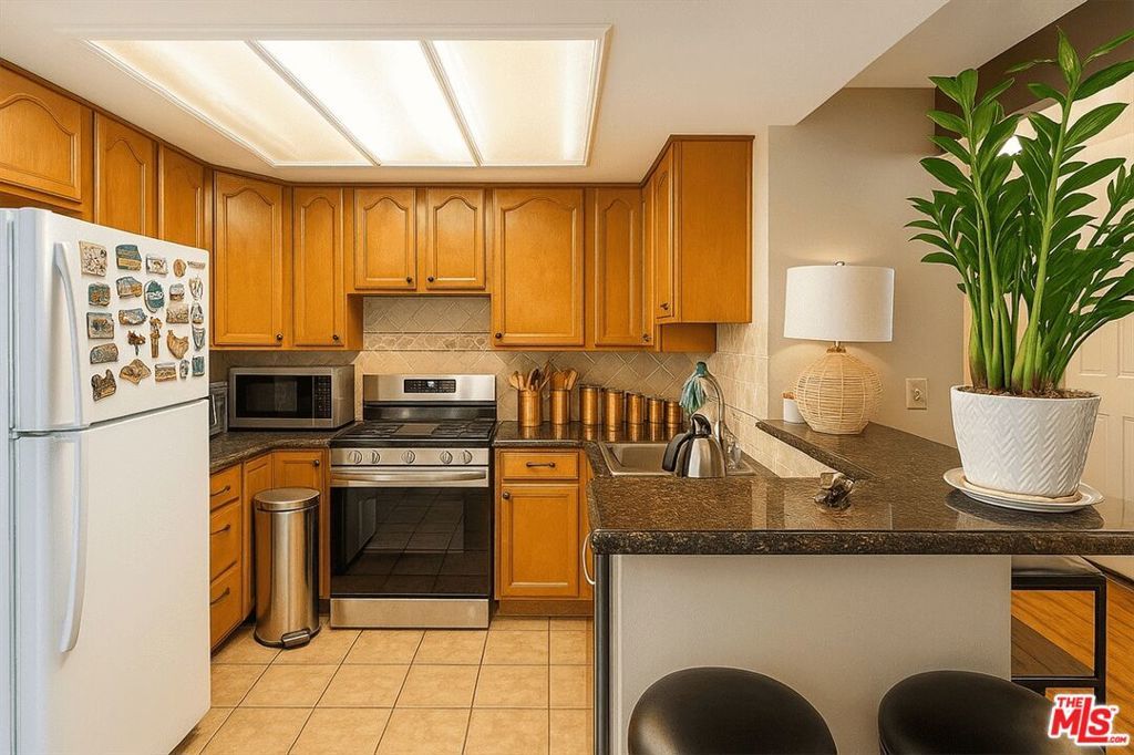 Photo of 15511 SHERMAN Way #24, Van Nuys, CA 91406 (MLS # 25552119)