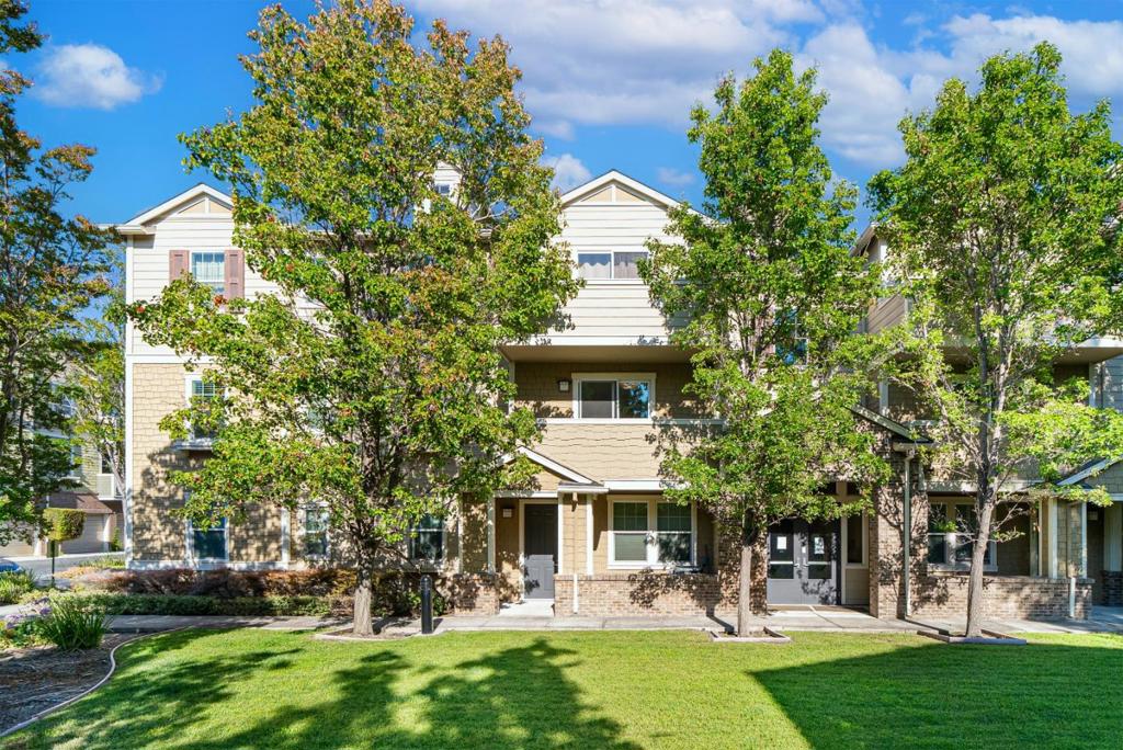 Welcome to the highly sought-after Tasman Crossing community, nestled in the heart of Silicon Valley! This exceptional home sits in a prime spot on Crossman Place the only building fronted by a serene, park-like lawn. Enjoy ultimate peace and privacy in this quiet interior unit, uniquely surrounded by trees instead of neighboring windows. As a true corner unit, it offers complete privacy with no shared walls. The Google shuttle conveniently stops right out front. The modern, open-concept layout includes a private attached garage, a second designated parking space right next to it, plus an additional outdoor storage unit and access to guest parking. Freshly painted with brand-new luxury carpeting, this home also features in-unit laundry and stainless steel appliances. Just a 5-minute stroll to Seven Seas Park, grocery stores, and VTA, with easy access to highways 101, 237, and 85 and close to major tech employers.