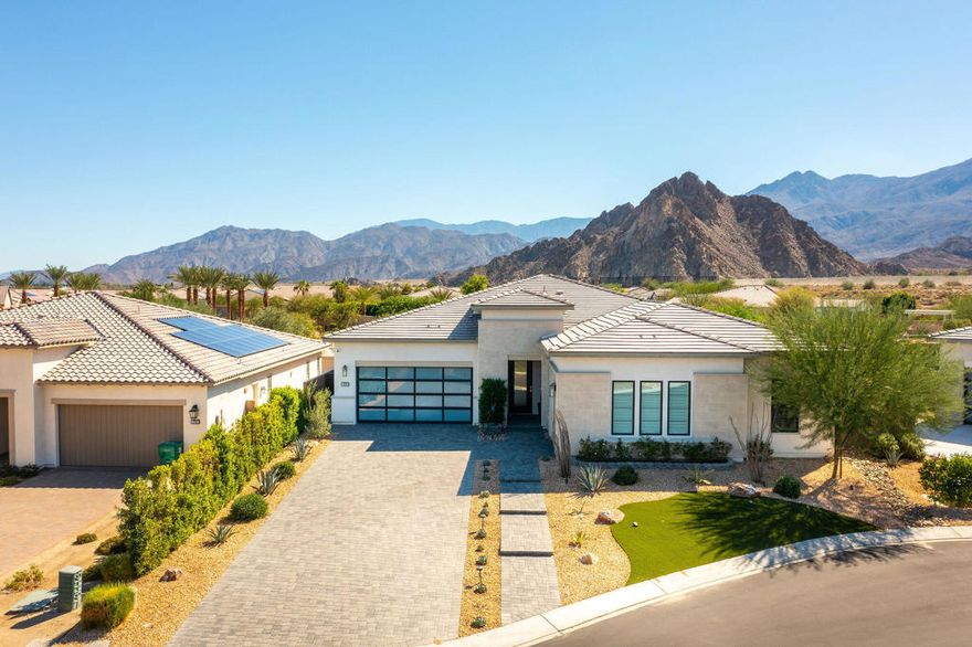 Discover your private sanctuary in Stone Creek Ranch, an exclusive gated enclave in South La Quinta where cascading waterfalls and streams flow into three serene ponds along beautifully landscaped walking paths.This meticulously appointed Larrea floorplan home showcases contemporary architecture with dramatic 12-foot ceilings and innovative 90-degree cornerless stacked sliding doors that completely disappear, seamlessly connecting the expansive great room to your sun-drenched southern exposure backyard.The owners invested $250,000 in premium upgrades including professional landscaping with exterior lighting, paver driveway, built-in barbecue island, pool fountain, custom window treatments, closet build-outs, and Cambria stone accents. The resort-style backyard features a pristine pool and spa perfect for entertaining.The gourmet kitchen boasts an oversized center island with breakfast bar, walk-in pantry, and abundant storage. The luxurious primary suite offers backyard access, a spacious walk-in closet, and a spa-inspired bathroom with dual vanities, soaking tub, and walk-in shower. Two additional guest suites each include walk-in closets and private en-suite bathrooms. The home also features a spacious 3-car garage.Stone Creek Ranch places you minutes from championship golf, tennis, pickleball, hiking trails, acclaimed dining, and the state-of-the-art Acrisure Arena--La Quinta living at its finest.