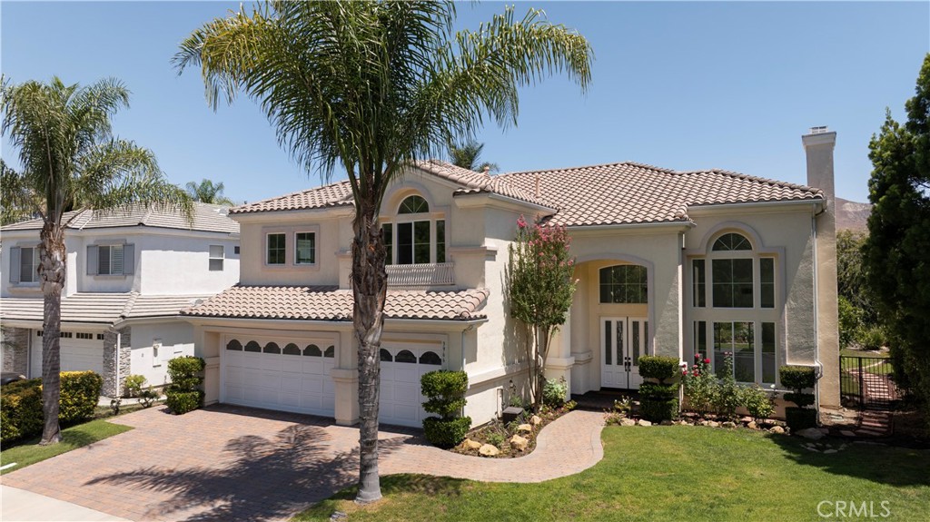 Welcome to this stunning 5-Bedroom home in the exclusive gated community of Calabasas View, on the border of Calabasas and Agoura Hills. Located on a quiet cut-de-sac with breathtaking views, this 2-story home offers 5 spacious bedrooms, 4 1/2 bathrooms, 3,602 square feet of living space and a 3-car garage—perfect for those seeking comfort and style.
Enjoy an open floor plan with vaulted ceilings, abundant natural light, and a formal dining room. A downstairs bedroom and private full bath offer convenience for guests or multi-generational living. Recently remodeled, the chef-inspired kitchen opens to the family room, making it ideal for entertaining. Upstairs, a versatile loft space is perfect for a child’s play area or home office. Retreat to the large, private primary bedroom with a fireplace, an expansive en-suite bathroom, and a spacious walk-in closet. Ideal for outdoor gatherings, the backyard offers sweeping canyon and hillside views, a spacious patio, and a grassy area perfect for play or pets. Inside, the home has updated wood-look flooring, carpeting, and a fresh coat of paint throughout — creating a modern, move-in-ready feel.
Set in a picturesque, tree-lined neighborhood, this rare gem is conveniently located near the 101, Erewhon, The Commons of Calabasas, a 12 minute drive to the Westlake Village Promenade and a 15 minute drive to the beaches of Malibu. Located in the award-winning Las Virgenes School District, the home is near De Anza Park, biking and hiking trails. Perfect for those who desire serene living with easy access to to Malibu and surrounding areas. Don't miss the opportunity to call this beautiful home yours!
SoCal living at its finest.