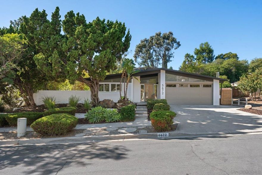 Authentic Mid-Century Modern, Reimagined with Integrity. Designed by renowned architect Leonard Drogin and thoughtfully remodeled by Maverick Design in partnership with Wedgewood Homes, this Del Cerro single-story residence is a true celebration of mid-century modern architecture. Every detail honors the era’s signature style—clean lines, clerestory windows, open beam ceilings, and an effortless connection between indoors and out. Natural light pours into this space, illuminating expansive living spaces anchored by a classic fireplace and framed by original architectural elements. The gourmet kitchen, surrounded by windows, is both functional and artful—perfect for those who appreciate design-driven living. Featuring four bedrooms plus an office, this home balances iconic style with everyday comfort. The primary suite offers a serene retreat with a massive walk-in closet and a beautifully updated en-suite bath. Both bathrooms reflect period-appropriate finishes reimagined for modern life. Outside, a large grassy yard and patio invite relaxed entertaining, while the block wall and clerestory façade create striking curb appeal that defines mid-century authenticity. Solar panels enhance energy efficiency without compromising design integrity. Set on a quiet cul-de-sac near top-rated schools and steps from a private park with pool and tennis courts (membership optional, waitlist may apply), this home is far from ordinary—it’s a true mid-century masterpiece for the discerning modernist.