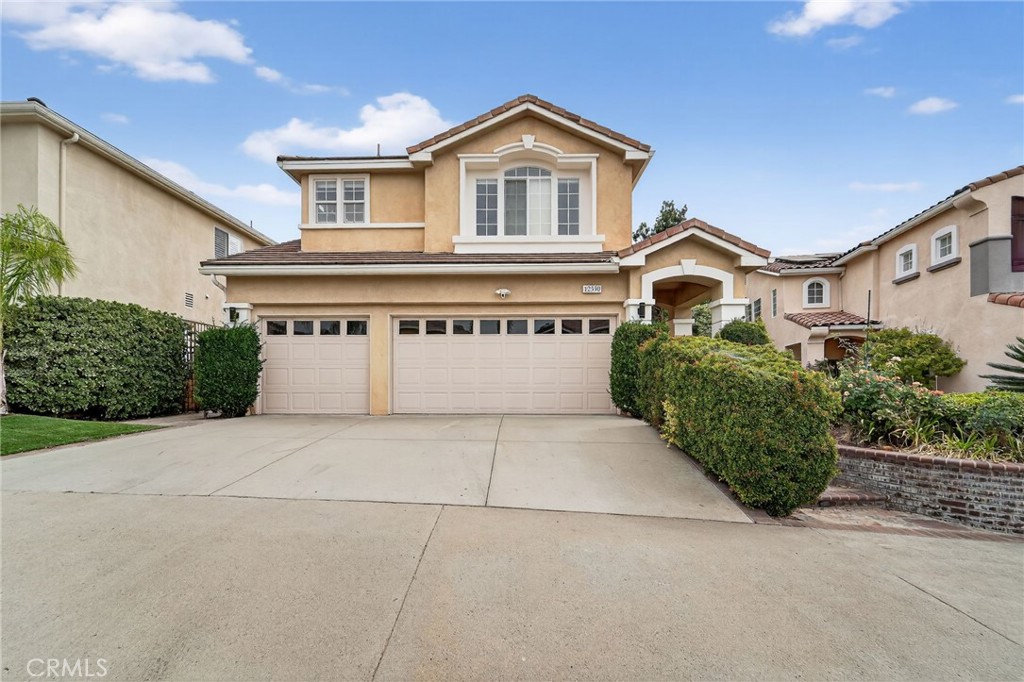 Nestled within the highly desirable gated Highlands community, this spacious 2-story home offers 4 bedrooms, 3 bathrooms, and 2,282 SF of living space on a 6,600 SF lot. Enjoy a bright, open floor plan featuring soaring ceilings, a cozy living room fireplace, and a formal dining area perfect for entertaining. The kitchen boasts a center island, granite countertops, and a charming breakfast nook with direct access to the covered patio and backyard. Upstairs, the primary suite offers a walk-in closet, dual sinks, a soaking tub, and a separate shower. Additional highlights include a 3-car attached garage, indoor laundry room, and fresh updates throughout. Residents enjoy access to community amenities including a pool, spa, and tennis courts — all within minutes of top-rated schools, parks, shopping, dining, and the Porter Ranch Town Center.