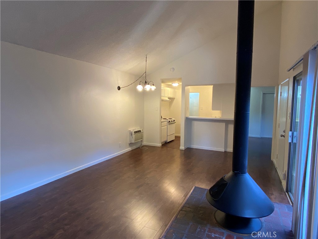 Peaceful, upper-level condo in a gated community with lush landscaping and tranquil lakes! Wood laminate flooring throughout. Private patio with spacious storage closet. Newer wall AC unit. Not one but TWO assigned covered parking spots (next to each other, and very close to the unit). The complex features scenic lakes, walking bridges, fountains, and a host of useful amenities: Pools, spas, tennis courts, a gym, a sauna, a community laundry facility, and a fantastic clubhouse! Walk to El Dorado Regional Park (and dog park)! Conveniently located with easy access to the 605 fwy. This one won't last!