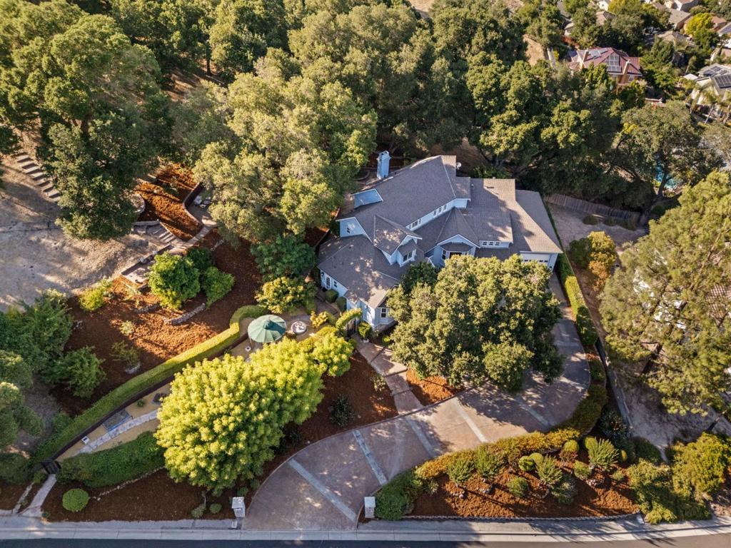 Truly gorgeous custom home in the most desirable area of Gilroy! Great location with the best schools, easy commute and within walking distance of parks, a gorgeous neighborhood, school and beautiful surroundings. You will love this prestigious home in this paradise setting. This home was custom built with the most thoughtful details inside and out! Natural light throughout offers great everyday living and an entertainer's dream for sure! Chef inspired kitchen with large gas stove, custom fridge, warming drawers and enormous pantry. Spacious living and huge backyard with hot tub, fountain and backyard granite kitchen/ BBQ area, surrounded with the most beautiful landscaping, views, and open space. Indoor/Outdoor resort style living at its finest. This impressive home features formal living room, great family room, formal dining room, office/library area, 5 bedrooms plus a bonus room and a truly gorgeous entry. 3 Fireplaces Plus Multi Zoned Heating & Air Conditioning systems for optimum climate control. Huge garage with space for 4 or more cars, full RV hookups & workshop area. This home exudes elegance, and comfort which is a rare and combination! You will be proud to come home to this estate home is one of the most sought after communities of South County!