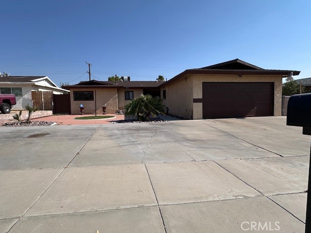 Beautifully updated move-in ready home in a quiet neighborhood. This home has it all! All appliances are included as well as a whole home water softener and reverse osmosis system. It has been updated with granite counter tops, laminate flooring, new paint, and A/C as well as, evaporative cooler. The master bedroom has been expanded to include a walk-in closet, and the bath has a walk-in jacuzzi tub. The large bonus room has its own mini-split system for heating and cooling and can be used as a family room or another bedroom. This is a must see.
