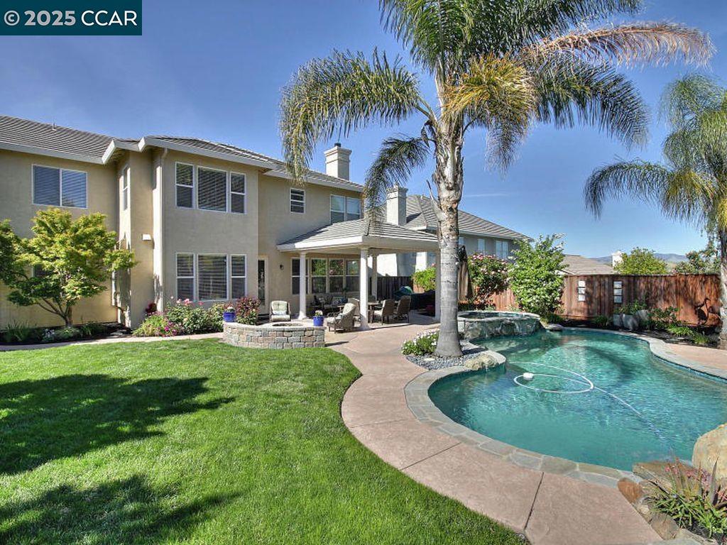 Wow! Beautiful 5 bedroom, there bath home located in great neighborhood of Westside San Ramon. Top notch schools Neil Armstrong/Pine Valley/Cal Hight. Just minutes to shopping and restaurants. Enter into two story living room with soaring ceiling and tons of natural light. Open concept eat-in kitchen and family room. Kitchen has granite counters, center island, all state of the art built in appliances and tons of cabinet space. Open to the family room and surrounded by windows looking out to the park-like yard. The back yard is a virtual oasis with spa, pool and covered patio for outdoor meals and entertaining. Beautifully landscaped and totally private and quite. Feels like a vacation! Deluxe master suite and large master bath. Over 3,100 sf of living space on large 8,700 sf lot.