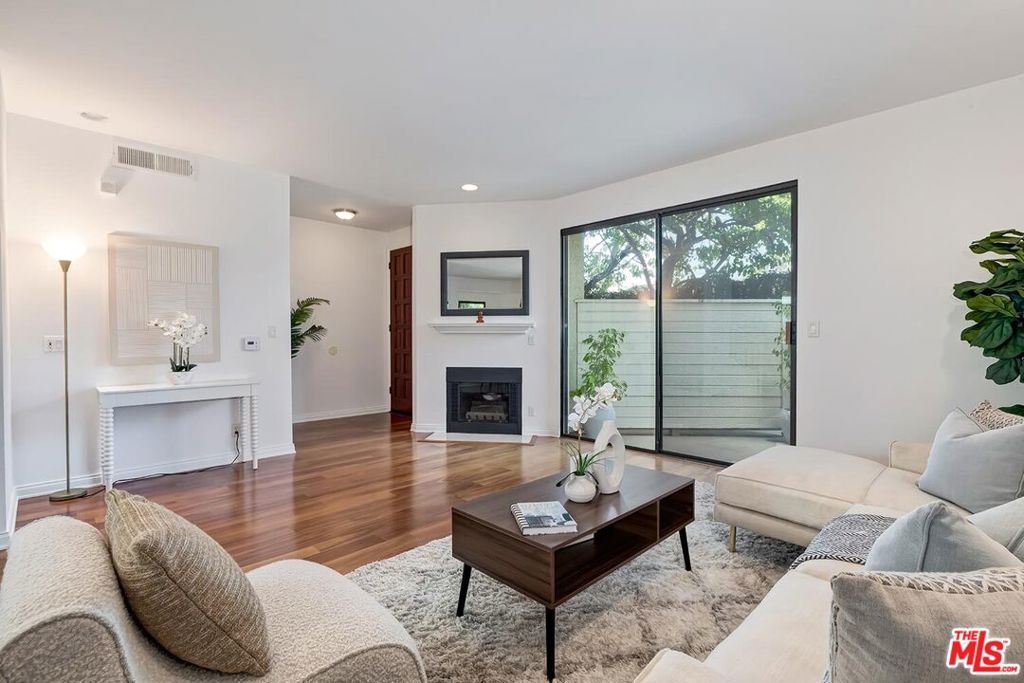 Welcome to your new home in the heart of Santa Monica! This inviting 2-bedroom, 2.5-bath condominium is a hidden gem offering endless possibilities. Step inside to discover beautiful laminate wood floors that flow seamlessly throughout the spacious layout. The bright and airy living area invites you to relax and entertain, while the generously sized eat-in kitchen is perfect for culinary adventures. Retreat to the primary suite, where vaulted ceilings flood the room with light and spaciousness. Then step out onto the balcony to enjoy breathtaking sunset views. This suite also boasts generous closet space and an en-suite bathroom featuring a separate shower and tub. The second bedroom, with an en-suite bathroom, offers flexibility for guests or a spacious home office. Imagine personalizing this space with a few modern updates to truly make it your own sanctuary. Enjoy the outdoors with a large front patio, ideal for relaxing with a book or alfresco dining, and a private backyard that provides a perfect setting for gardening. Enjoy the added perks of in-unit laundry for convenience, secure building access, a private storage room, and side-by-side parking in a secure gated garage. Located just minutes from the sun-kissed beaches, lush parks, and the vibrant shopping, dining, and entertainment scene of Santa Monica, this home promises an unbeatable lifestyle. Don't miss out on this incredible opportunity to live in one of Southern California's most sought-after neighborhoods. Embrace the potential and make this condo your own coastal haven today!