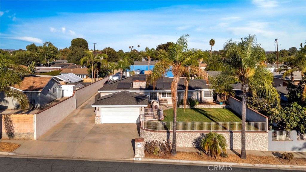 Welcome to 12212 Corley Dr. Set on over 13,000 sq. ft. of flat, usable land, this Whittier property combines comfort, privacy, and potential. The single-story home offers 4 bedrooms, 2 bathrooms, and nearly 1,900 sq. ft. of living space with a thoughtful layout that includes multiple living areas, an indoor laundry room, and a private primary suite. Well maintained over the years, the home reflects quality upgrades and remains move-in ready. What truly sets this home apart is the backyard with its own gated driveway access, providing endless possibilities for RVs, boats, work vehicles, or even a workshop or home business, while still leaving plenty of room to grow. A swimming pool, covered patio with misters, and built-in BBQ set the stage for outdoor entertaining, while a separate turf area with a custom rock-climbing wall adds even more recreation. Inside, the main living area is enhanced by a built-in entertainment system with speakers and a stone fireplace, bringing both convenience and warmth. With room to expand and potential for an ADU or second dwelling, the property offers flexibility to meet a variety of needs. This is not your typical Whittier property. It is a one-of-a-kind home that gives buyers the freedom to create or simply enjoy the space as it is. Perfect for multi-generational families or seasoned investors looking for flexibility and long-term value. Don’t miss the chance to call 12212 Corley Dr. "home" — you will not find another like it.