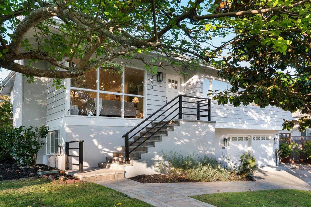 Welcome to this thoughtfully redesigned 4-bedroom, 3-bathroom home in Millbrae's highly desirable Meadows neighborhood. Recently updated, this home offers a welcoming layout that flow naturally for everyday living. You're welcomed by a warm and inviting living room with a cozy fireplace, flowing naturally into a defined dining area, sunny breakfast nook, and spacious kitchen with generous storage space. Off the dining area, step outside to an expansive deck with a built-in hot tub, overlooking a beautifully landscaped backyard, an ideal setting for relaxing or hosting family and friends. Down the hall are three comfortable bedrooms, including two with en-suite baths, one being a spacious primary suite. The lower level features a family room with a second fireplace, a fourth bedroom, a full bathroom, and interior access to a generous garage with bonus space perfect for a home gym, workshop, or storage. Lovingly maintained and upgraded with solar panels, new roof, furnace, heated floors, updated lighting, and more. Close to top-rated schools, shopping, dining, parks, and major commuter routes, this move-in ready home offers comfort, convenience, and lasting value.