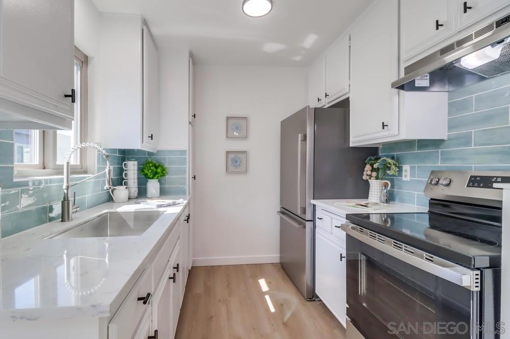 STUNNING REMODELED LA MESA VILLAGE CONDO with all the bells & whistles! NEW EVERYTHING. Light & bright with all new paint, new honeysuckle water resistant LVP Floors, new baseboards, light fixtures, and NEW adorable kitchen! NEW Quartz counters, Seaside polished tile backsplash, stainless steel refrigerator, stove & hood, single basin sink with pulldown faucet, & black matte knobs. NEW 6 light farmhouse chandelier in dining area. Large bedroom with FULLY REMODELED BEDROOM with NEW weathered tan vanity with... white tone top, sink, metal framed mirror & modern black vanity light, black matte faucet & accessories. NEW shower tub & toilet. Large storage cabinet & large closet with new tracks. Assigned, covered parking spot. Unbeatable location just a block from downtown La Mesa's shops and restaurants. Hurry, this one won't last!