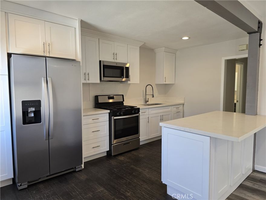 Move right into this beautifully updated 1-bedroom, 1-bath home ideally located near Chapman University and the charming Old Towne Orange Plaza. The interior features fresh designer finishes including wide-plank flooring, neutral paint, and plenty of natural light. The modern kitchen is equipped with quartz countertops, white shaker cabinetry, stainless steel appliances, and a breakfast bar that opens to the living space. The updated bathroom offers a clean, contemporary look with sleek tile flooring and fixtures. A private single-car garage provides added convenience. This home combines comfort, style, and location—just minutes from shopping, dining, freeways, and the historic Plaza in the heart of Orange.