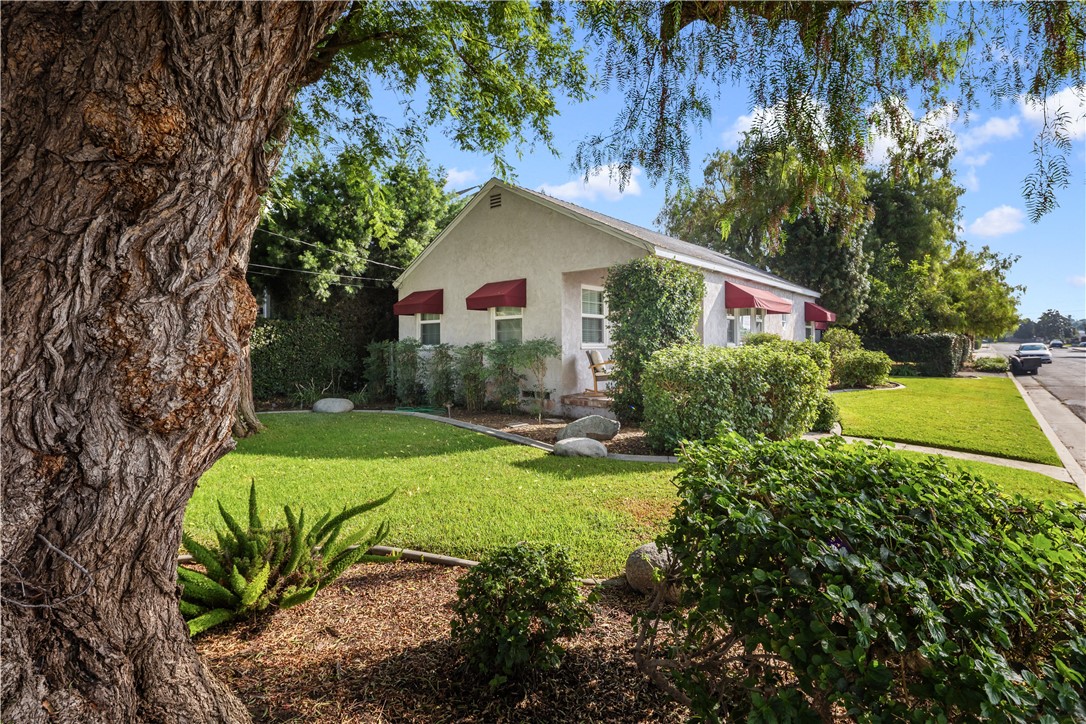 Classic 1949 single-level home in central Glendora featuring 2 bedrooms, 1 bath, and approx. 1,198 sq ft on a 5,903 sq ft corner lot * Single-level convenience and a manageable footprint in a walkable location * Light and bright living/dining area connects to a well-planned galley kitchen with stainless steel appliances, granite counters, recessed lighting, open shelving, and an island with in-kitchen seating * Full bath includes a granite vanity and a tub/shower combo * Bedrooms recently painted with new carpet and window blinds * Laundry in garage (washer & dryer) * Outdoors offers established shade trees plus avocado and lemon trees * Attached 2-car garage with direct access and a convenient pull-through driveway provides additional on-site, behind-the-gate parking * Walking distance to Downtown Glendora shopping, coffee shops, and restaurants, and to the new Glendora Gold Line station * Near San Gabriel foothill walking/hiking trails, Glendora Dog Park, multiple neighborhood parks, and new pickleball courts * Located within award-winning Glendora Unified School District * Buyer to verify all measurements, features, permits, school assignments, and local amenities. Equal Housing Opportunity.