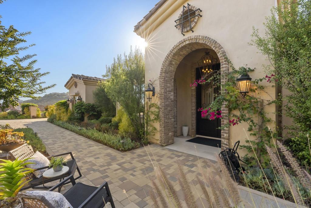 Intentional Living and Artfully Designed Mediterranean Estate! Experience a sanctuary of sophistication and modern elegance in this custom-inspired estate nestled in the prestigious guard-gated community of Cielo, Rancho Santa Fe. This nearly new estate (2017) promises an unparalleled lifestyle of privacy, framed by spectacular mountain to ocean views from some of the highest vantage points along the San Diego coast. This single-level estate boasts a modern architectural design with four bedrooms, four full baths, and two half baths. The executive office/media room invites productivity, while the expansive great room, with its seamless indoor-outdoor flow through disappearing glass doors, becomes the heart of gatherings. The artfully curated kitchen is a culinary dream, showcasing quartz countertops, a grand center island, a spacious walk-in pantry, and top-tier commercial-grade appliances, making it a perfect blend of style and functionality. Exposed antique beams and a stunning fireplace create an inviting atmosphere, complemented by an entertainer’s wet bar and a walk-in wine cellar, perfect for hosting intimate gatherings and unforgettable evenings. Retreat to the primary suite—a personal haven featuring direct patio access, a spa-inspired bath complete with an oversized soaking tub, dual vanities, and a boutique-style walk-in closet with custom built-ins. This sanctuary embodies tranquility and luxury. The true crown jewel of this estate is its outdoor oasis with its custom pool and spa that seemingly flow into the horizon, surrounded by a cozy, fireplace-warmed lo.. This single-level estate boasts a modern architectural design with four bedrooms, four full baths, and two half baths. The executive office/media room invites productivity, while the expansive great room, with its seamless indoor-outdoor flow through disappearing glass doors, becomes the heart of gatherings. The artfully curated kitchen is a culinary dream, showcasing quartz countertops, a grand center island, a spacious walk-in pantry, and top-tier commercial-grade appliances, making it a perfect blend of style and functionality. Exposed antique beams and a stunning fireplace create an inviting atmosphere, complemented by an entertainer’s wet bar and a walk-in wine cellar, perfect for hosting intimate gatherings and unforgettable evenings. Retreat to the primary suite—a personal haven featuring direct patio access, a spa-inspired bath complete with an oversized soaking tub, dual vanities, and a boutique-style walk-in closet with custom built-ins. This sanctuary embodies tranquility and luxury. The true crown jewel of this estate is its outdoor oasis with its custom pool and spa that seemingly flow into the horizon, surrounded by a cozy, fireplace-warmed lounge equipped with a flat-screen TV. Beautiful landscaping, hardspacing and fully equipped outdoor kitchen, featuring a Lynx BBQ and granite bar seating for six, create an idyllic setting for al fresco dining, relaxing evenings or entertaining against the backdrop of stunning ocean and mountain vistas. Emphasizing both sophistication and sustainability, this home operates on 100% solar power and features drought-conscious landscaping, ensuring that luxury and efficiency go hand in hand. The property also features a 3-CAR garage with mahogany garage doors and fully finished versatile loft / attic. Every moment spent here is a step into a spa-like retreat, capturing the essence of the ultimate California lifestyle with views to Catalina Island on a clear day. Cielo in Rancho Santa Fe offers a vibrant, luxury lifestyle. Enjoy a full calendar of social activities - plus exceptional amenities including a community center, gym, clubhouse, tennis and pickleball courts, playgrounds, multiple pools, and courts for basketball and volleyball, all included with the HOA. This property is located in Rancho Santa Fe School District - Roger Rowe