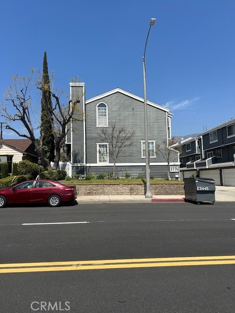 This beautifully designed contemporary townhouse offers an exceptional value and a fantastic floor plan. The unit is bathed in natural light, creating an open and airy feel. It's ideally located near trendy restaurants, shopping, and public transportation. The living room boasts soaring ceilings with two-story windows that flood the space with light. Sliders lead to a spacious, private, and gated patio. The living room features a cozy fireplace, adding warmth and charm, with a view of the secluded fenced patio, creating a welcoming atmosphere. Nestled in the heart of the complex, this unit offers both peace and privacy.
The middle level includes a large dining area that opens onto an east-facing balcony. The kitchen is equipped with granite countertops and appliances, including a refrigerator, dishwasher, and range. A convenient half-bath is also located on this level.
Upstairs, you'll find two generously sized master suites, each featuring high ceilings, walk-in closets, new carpeting, and private baths. The laundry hookups are conveniently located on this bedroom level.
This unit is in excellent condition, with fresh paint throughout and new carpeting in both bedroom suites. Additionally, new ceiling fans have been installed. On the lower level, you'll find a private, attached two-car garage with extra storage space.
The HOA fee covers water, trash, master insurance, and earthquake insurance.