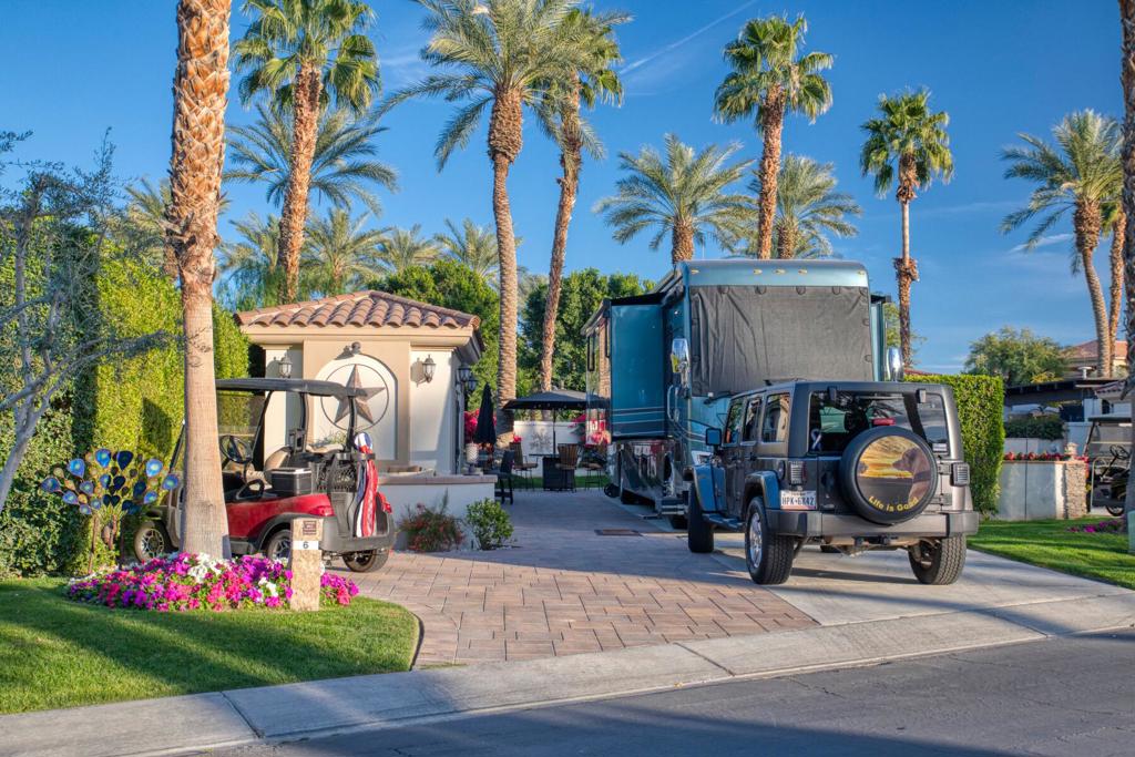 Lot 6 offers a rare blend of privacy and scenic views at Motorcoach Country Club. Unlike many privacy lots that face other coaches, this property overlooks a beautifully landscaped common area with a charming fountain illuminated by colorful lights, creating a peaceful, picturesque setting. Located just steps from the clubhouse, putting green, and fitness center, it offers unmatched convenience for enjoying all the resort's luxurious amenities. The casita features a bathroom with a shower, built-in desk, and ample storage. The double-door entry welcomes you into a well-appointed space for extended stays or quick retreats. Outside, a cozy fire pit leads to an L-shaped bar with stools, a BBQ, and a washer/dryer. Pavers are laid throughout, offering a polished outdoor environment. In the backyard, a second fire pit and fire table with chairs make for perfect evening relaxation. An awning extends from the casita to cover the bar, adding shade and comfort during fall and winter months. Lot 6 offers both privacy and easy access to the best of Motorcoach Country Club--a fantastic opportunity for luxury motorcoach living. Motorcoach Country Club exclusively accommodates Class A motorhomes from 30' to 45'. Due to zoning, on-site properties are not considered dwellings, and overnight stays inside them are not allowed. MCC's annual Food & Beverage minimum is $2,080.