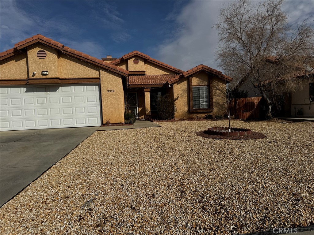 Come see this single 2 bedroom & 2 bath home. Located on the west side of Rosamond in one of the most desirable neighborhoods. Beautiful Laminate floors throughout the interior, recessed lights throughout with new plugs., central air/heat. Both bathrooms are recently updated. Nice size kitchen with countertops and retro color kitchen cabinets. Livingroom has nice high ceiling with a fireplace. Stainless steel appliances. Large backyard for relaxation, including new concrete in the back and new hardscape in the front, new garage door, Close to Edwards Airforce Base. This stunning Rosamond home is ready to move in! Come take a look TODAY!