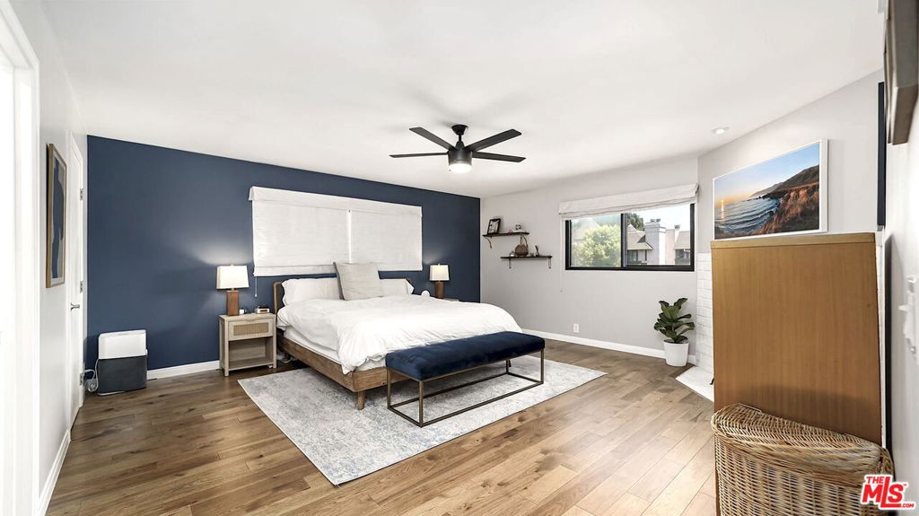 GREAT LOCATION! This stunning townhouse located in the heart of Culver City. A rare front unit with vaulted ceilings, loads of natural light throughout the day, and includes tree top views from the upper level. Enter into an open floor plan that flows from a spacious living room, to the dining room with built-in serving station, and out to a hedged balcony perfect for BBQ. Designer updates throughout define this special offering and make it an entertainer's dream. The elegant, elevated kitchen features updates including new stainless steel sink with instant hot water spigot. A chic powder room and dedicated laundry closet round out the main floor. Upstairs are two generously large bedrooms, each with walk-in closets. The primary suite has new hardwood flooring, sound-proof windows, and a gorgeous en-suite bathroom. The secondary spacious bedroom includes remote control shades, sizable closet plus built-in shelving, and its own private balcony. An additional, well updated bathroom with a porcelain tub is a perfect retreat at the end of the day. With so much space, some units have converted this floor plan into a three bedroom. Downstairs is a large two-car garage plus a storage room with shelves and room for skis, bikes, and more. Additional upgrades include new HVAC, new microwave, Smart Lock at entry, and overhead storage shelf in garage. HOA recently invested in updating outdoor balconies. This town home offers all the amenities for modern living and is located in one of the best locations. Just moments away from Downtown Culver City, the Baldwin Hills Scenic Overlook, The Culver Steps, Ballona Creek Bike Path, Silicon Beach, and loads of dining and entertaining options. Located in the highly rated Culver City Public School District. Low HOA fees include EQ Insurance.