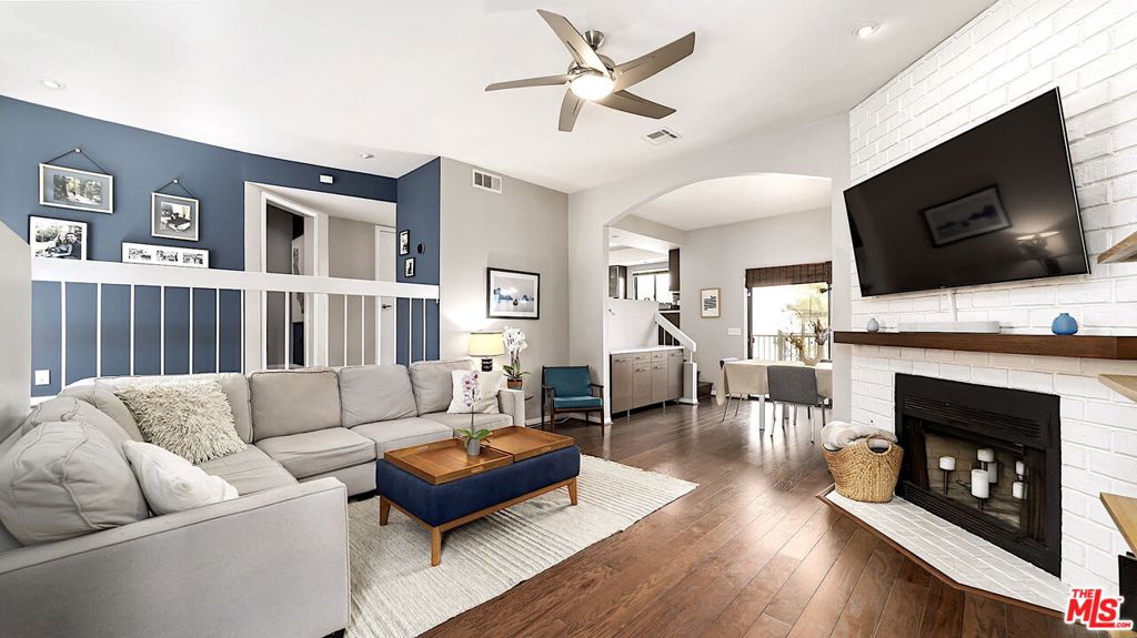 Stunning townhouse located in the heart of Culver City! This rare front unit has vaulted ceilings, receives loads of natural light throughout the day, and includes tree top views from the upper level. Enter into an open floor plan that flows from a spacious living room, to the dining room with built-in serving station, and out to a hedged balcony perfect for BBQ. Designer updates throughout define this special offering and make it an entertainer's dream. The elegant, elevated kitchen features updates including new stainless steel sink with instant hot water spigot. A chic powder room and dedicated laundry closet round out the main floor. Upstairs are two generously large bedrooms, each with walk-in closets. The primary suite has new hardwood flooring, sound-proof windows, and a gorgeous en-suite bathroom. The secondary spacious bedroom includes remote control shades, sizable closet plus built-in shelving, and its own private balcony. An additional, well updated bathroom with a porcelain tub is a perfect retreat at the end of the day. With so much space, some units have converted this floor plan into a three bedroom. Downstairs is a large two-car garage plus a storage room with shelves and room for skis, bikes, and more. Additional upgrades include new HVAC, new microwave, Smart Lock at entry, and overhead storage shelf in garage. HOA recently invested in updating outdoor balconies. This town home offers all the amenities for modern living and is located in one of the best locations. Just moments away from Downtown Culver City, the Baldwin Hills Scenic Overlook, The Culver Steps, Ballona Creek Bike Path, Silicon Beach, and loads of dining and entertaining options. Located in the highly rated Culver City Public School District. Low HOA fees include EQ Insurance.