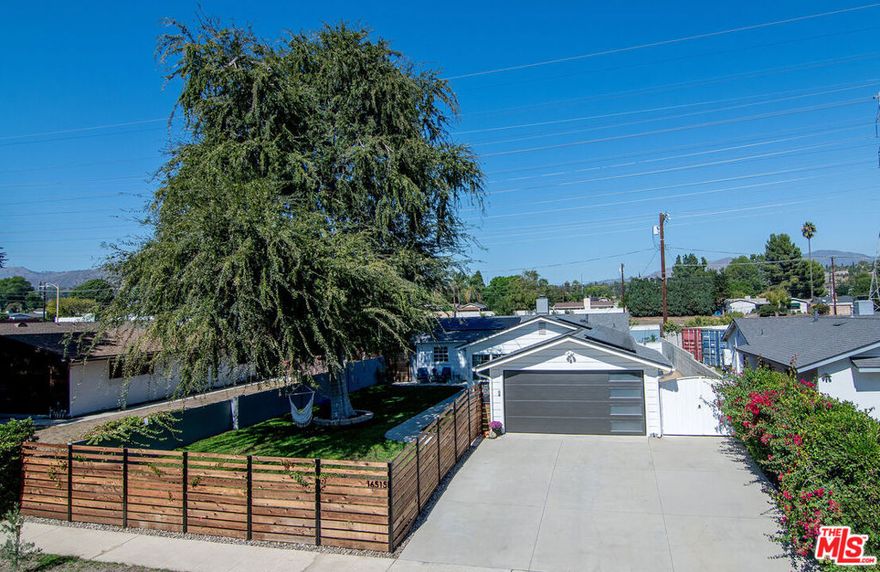 Welcome to this inviting 4bd/2ba Granada Hills home! Set on a spacious 7,574 sq ft lot, this 1,352 sq ft residence blends comfort, functionality, and California outdoor living. Enjoy ample outdoor entertaining with a large fenced-in front yard and a spacious screened-in covered patio directly off the main living area and kitchen. Updated kitchen features stainless steel appliances and granite counters and opens to a large living room. 4th bedroom off the living room is a great office or playroom, and then 3 additional good-sized bedrooms along with 2 upgraded and recently replumbed bathrooms (2023). Enjoy peace of mind with a new roof (2022) and solar panels (2022), upgraded 200-amp electrical service (2023), recently painted exterior (2023), and a number of other upgrades. The grassy backyard offers plenty of room to play or garden, or you could relax in the pergola-shaded "cowboy pool." Ideally located on a quiet street and move-in ready, this just might be the home you have been looking for.