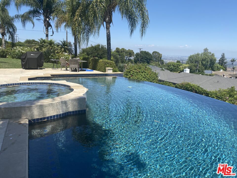 Welcome to 6 Toprail Lane, on a private, secluded and rare 29,815 sq ft lot, where breathtaking harbor views meets modern luxury in Rancho Palos Verdes.Additionally, a city of award winning schools. Upon entering the manicured coastal landscaped palatial property, you will realize this is the home to live for. It offers, 5bedrooms and 4 baths, the layout is functional and utterly exquisite. The primary bedroom is complete with its own full bath and private balcony, but can easily convert intoa fifth bedroom or exclusive designated guest wing. The gourmet kitchen is a bright culinary chef's dream, with custom cabinetry and expansive countertops perfect formeal prepping and dining. This luxury estate is ideal for setting the mood for special occasions and holiday events, movie nights, or pool parties. The living room with thefloor to ceiling windows is a retreat all its own, with a cozy fireplace. As the family and guests exit outdoors to the backyard it becomes vacation vibes in the private oasis,with a pool and spa and plenty of room for entertainment. This is a perfect upgraded home to host soiree's throughout the year. This home feels like heaven on earth withastonishing, sunrises and sunsets to live for. Also, Rancho Palos Verdes offers many Community and Cultural amenities such as beaches, parks & recreation, biking,equestrian, hiking, walking trails, sports facilities, and dog parks. Other Amenities: Avana Rancho Palos Verdes, Palos Verdes Villa, Rolling Hills Country Club, Terranea Resort *Additional photos will be uploaded soon.