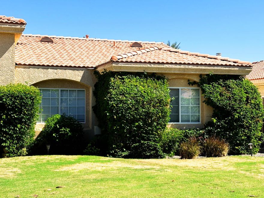 Welcome to the Quinterra Community, discover this beautifully maintained pool home nestled within a small gated community with a very limited number of homes, where comfort, privacy, and desert charm come together. This is a rare opportunity to own in one of La Quinta's most desirable and private neighborhoods, located within the highly regarded Desert Sands Unified School District.This inviting 3-bedroom, 2-bath residence offers approximately 2,100 sq. ft. of open living space and sits peacefully on a quiet cul-de-sac.Step inside to discover a bright, freshly painted interior with new carpet in all bedrooms and neutral tile flooring throughout the main living areas. The spacious great room features soaring ceilings, a striking stacked-stone fireplace, and large sliding doors that open to your private backyard retreat--perfect for seamless indoor-outdoor living.The kitchen offers ample cabinetry, a pantry, and a convenient breakfast bar that flows effortlessly into the dining and living areas.The primary suite is a true desert sanctuary, complete with its own fireplace, direct patio access, and a luxurious ensuite bath featuring a soaking tub, walk-in shower, dual vanities, and generous closet space.Step outside to your private oasis--a sparkling pool and elevated spa surrounded by lush landscaping and tall privacy hedges, ideal for relaxing or entertaining year-round.Additional highlights include a spacious  2-car garage with extra space for golf cart, indoor laundry room, and low-maintenance desert landscaping. Conveniently located near top-rated schools, shopping, and world-class golf and dining, this home perfectly blends resort-style living with everyday comfort.