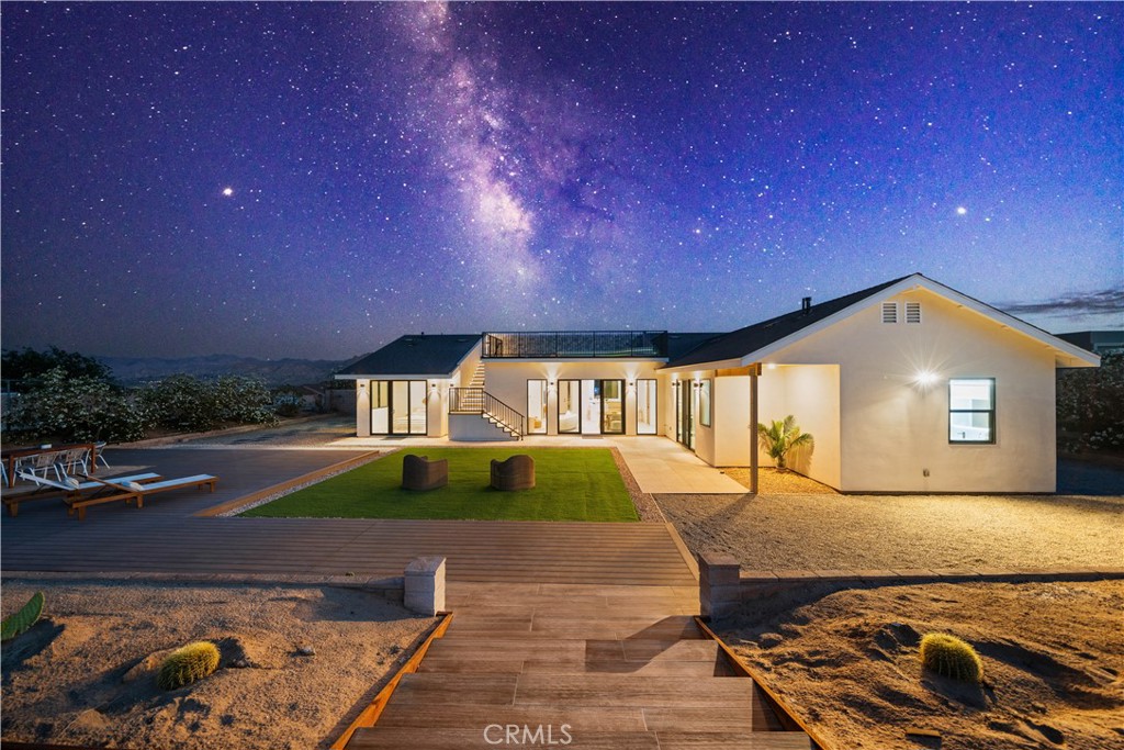 Welcome to this beautifully remodeled modern minimalist home! Located in a well-established community near a national park, this property boasts a generous 18,000 sqft lot, with 2,262 sqft of living space, featuring 3 bedrooms + a study and a spacious 500 sqft rooftop deck —an ideal spot for entertaining and stargazing, where you can enjoy breathtaking meteor showers and peaceful evenings under a canopy of stars.
Whether you're looking for a family home or an investment property for Airbnb, this home offers unmatched versatility. If needed, we can assist in obtaining the required permits for Airbnb operation.
Designed with modern simplicity in mind, this home emphasizes functionality and visual balance. The exterior features textured white stone paint paired with deep gray resin tile roofing and sleek black metal-framed windows and doors. The landscaping is accented with yellow desert plants and greenery, creating a clean, bright, and sophisticated aesthetic with black, white, and gray as the primary tones, complemented by vibrant yellow highlights.
Interior Highlights:
Open Concept Design: Minimal partitions create a spacious, airy flow throughout the home, enhanced by hidden storage systems for a clutter-free environment.
Functionality and Flexibility: Clean lines and geometric shapes define the space, avoiding overly complex decorations while maximizing visual clarity and adaptability through post-renovation soft furnishings.
Neutral Color Palette: Dominated by whites, grays, and blacks, with subtle pops of bright colors like yellow and orange to create a warm, inviting atmosphere.
Natural Materials and Textures: Wood, stone, and metal are seamlessly incorporated to strike a balance between simplicity and coziness.
Expansive Rooftop Deck: A 500 sqft space perfect for stargazing, entertaining, or simply unwinding in the open air.
Nestled near a national park, the property allows you to embrace nature while benefiting from the convenience of a well-established community. This home is more than just a place to live—it’s a lifestyle that celebrates quality, simplicity, and harmony.
Schedule your private tour today and secure your future in this elegant property!