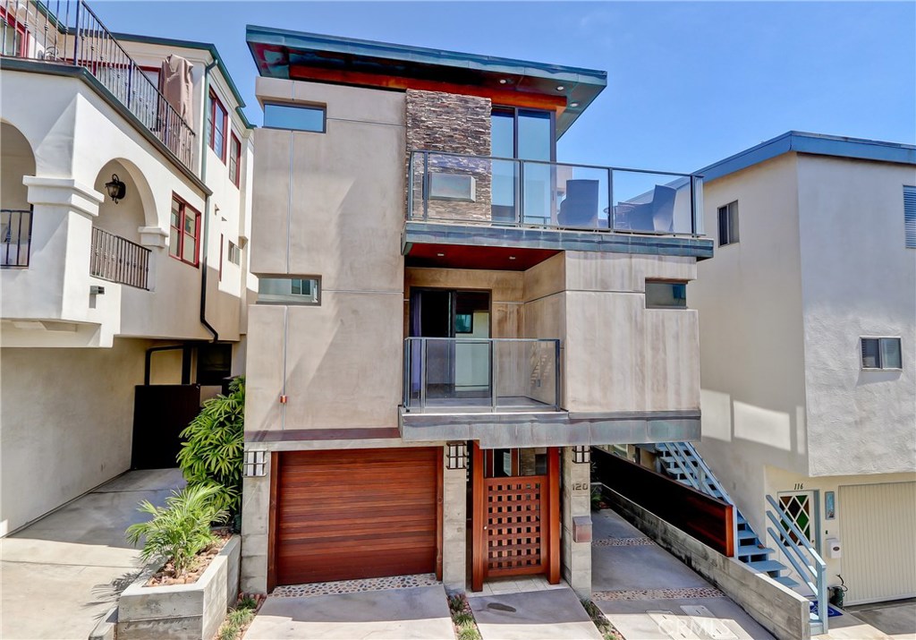 Located only three doors from the beach in highly coveted South Manhattan Beach, this sleek and sophisticated townhome offers the ultimate in coastal living. Nestled in the prestigious “Between the Piers” neighborhood, enjoy easy strolls to both downtown Manhattan Beach and Hermosa’s vibrant dining and shopping scenes.
Designed with dramatic architectural flair, the home welcomes you with a striking pivot door entry and a sculptural open staircase. Walls of retractable floor-to-ceiling glass blur the lines between indoors and out, framing panoramic ocean and whitewater views. Premium finishes abound—rich hardwood floors, artisan glass tile, and a state-of-the-art kitchen featuring stainless steel, top-tier appliances.
This home is as functional as it is beautiful, with a two-car tandem garage plus an additional covered carport for guests.
A rare opportunity to live in a modern coastal retreat in one of the South Bay’s most sought-after locations. The home will be unfurnished and the owner prefers a long term lease.