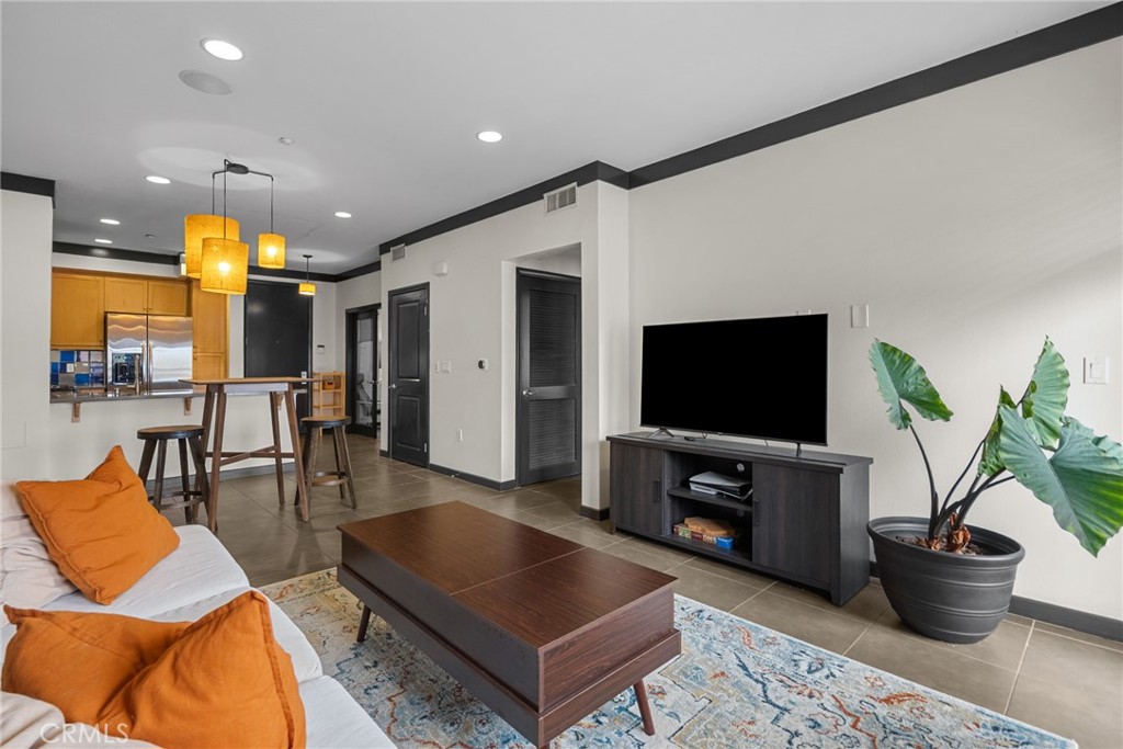 Motivated Seller!!! This beautiful condominium features 1 Office with a closet and a 1 bedroom and 1 full bathroom with approximately 864 square feet designed for both comfort and sophistication. From the moment you enter you will see an open-concept kitchen that leads to the living room, enjoy a bright and inviting living space with a functional layout.
The kitchen boasts stainless steel appliances, lots of storage areas as well as countertop space with lighting under cabinets. Elegant crown molding throughout the condo, pre-wired with Cat5 & cable connections, an alarm system with built-in stereo ceilings, and speakers in both bedrooms and living room. Step outside and take advantage of the community amenities including a sparkling pool with jacuzzi & BBQ area. HOA includes insurance, Water, Trash & Sewer paid, gated, and a relaxing community lounge area. Definitely a great opportunity you don't want to miss out on!!!
Location location location, near Disneyland, Great Wolf Lodge, Anaheim Stadium and lot's of restaurants to enjoy. There is an additional parking space that could potentially be available with the first right of refusal for a $300 fee per year.