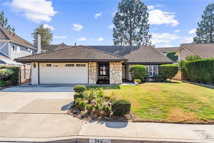 Welcome to 346 S Silverbrook Drive in the hills of Anaheim– a beautifully updated and highly coveted single-story estate in the desirable Orange Unified School District.



This stunning home features 3 bedrooms, 2 bathrooms, and nearly 2,000 square feet of living space on a generous 8,400 square foot lot. Step inside to soaring vaulted ceilings with beautiful exposed beams and an open, airy layout that feels both elegant and inviting. The home has been freshly painted and showcases brand-new luxury vinyl plank flooring and updated lighting fixtures and recessed lighting throughout.



The heart of the home is the newly remodeled kitchen, featuring crisp white shaker cabinets with modern hardware, quartz countertops, subway tile backsplash, a new dishwasher, and a professional-grade Wolf range stove and oven. The kitchen opens to a cozy breakfast nook and a spacious family room with a stunning gas stone fireplace. Sliding glass doors from both the family room and the primary suite lead to the outdoor patio and backyard, perfect for indoor-outdoor living and entertaining.



Additional upgrades include a brand-new garage door with lift system, a convenient inside laundry room with washer and dryer, central AC, and new recessed lighting.



Located within the top-rated Orange Unified School District, this home is served by Canyon High School, Crescent Elementary, and El Rancho Charter School. Enjoy easy access to shopping, restaurants, and nearby freeways for a convenient commute.



Move-in ready and meticulously updated, this single-level Anaheim estate blends modern luxury with timeless comfort — a true gem you won’t want to miss.