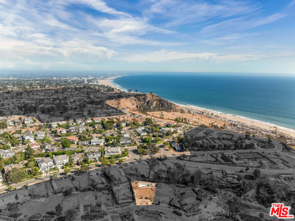 Perched above the coastline in the coveted El Medio Bluffs, this expansive 9,768 square-foot homesite presents an unrivaled opportunity to create a custom dream home in Pacific Palisades. Ideally positioned near the bluff front, the property offers potential for sweeping ocean and mountain views upon redevelopment. Plus, since much of this enclave remained untouched by the wildfire, conditions are primed for an expedited path towards revitalization. The lot has been fully cleared, with Phase 1 & Phase 2 environmental cleanup complete. Previously home to a single-level 3-bedroom, 2-bath residence with pool, the site now stands as a blank canvas to reimagine modern coastal living in one of Los Angeles' most sought-after neighborhoods. Just moments from Palisades Village, top-rated schools, hiking and biking trails, and the beach -- with seamless access to the Westside via Sunset Boulevard, Temescal Canyon Road, and Pacific Coast Highway -- this offering combines lifestyle and location at their very best. It's an opportunity to both contribute to the renewal of a cherished community and craft a home tailored to your unique vision.